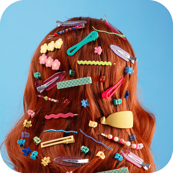 Woman dressed in blue showing her rings