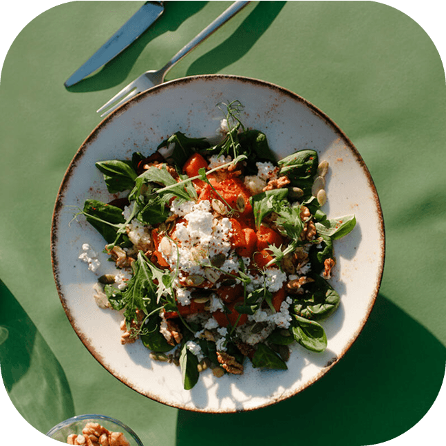 A plate with salad inside